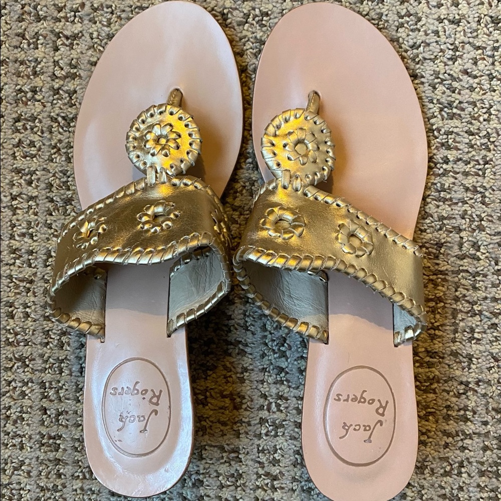 Like new gold metallic sandals. Never worn off carpet.